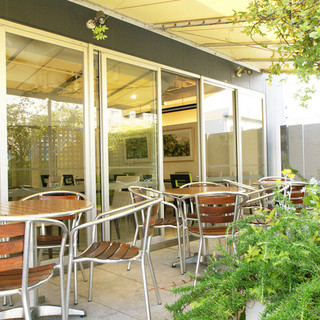 Authentic Italian Cuisine in a store uniformed in gentle colors and a terrace on the roof of the building.