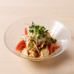 Steamed chicken and tofu salad with golden sesame seeds