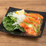 Salmon and avocado carpaccio with organic carrot dressing