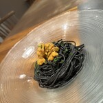 Cold kneaded squid ink pasta with raw sea urchin from Hokkaido