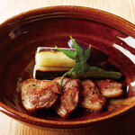 Grilled duck (domestic duck) served with green onions