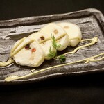 Homemade cheese ice cream and gyuhi roll with pistachio sauce