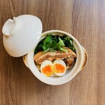 Braised pork and boiled egg in clay pot rice