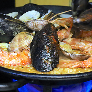 Enjoy our signature paella made with homemade stock and domestically grown rice