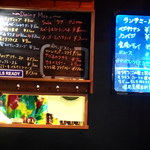 Spice&Dining KALA - 店内掲示の単品およびランチメニュー。さりげない「嘘発見器貸し出します」がにくい