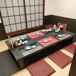 なんか喰ぃ亭 - ６名掛けの掘り炬燵のテーブル席（半個室）です