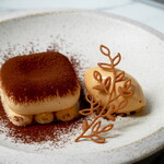 Rich and sophisticated tiramisu served with lotus biscuit ice cream