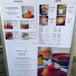 UNITY CAFE - 階段入口前に置かれたメニューボード