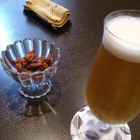 中国料理 かなめ - 生ビールはキリン一番搾り　￥４８０。クルミの飴炊き付き
