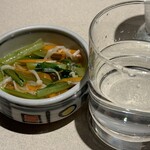 とり福 - 料理写真:お通しは味も出汁も薄い。隣は焼酎ストレート。なんでストレートって知られてないんだろう？オーダーしたお姉さん、氷入れようとして店主さんに「氷入れないよ」と言われてた。