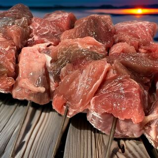 店主自慢のマグロはらみの炙り串