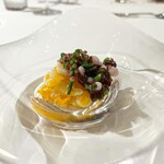 ウシマル - 炭火で焼いたタコ足と野菜