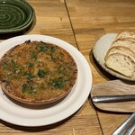 洋食 おがた - つぶ貝アンチョビバターソテー