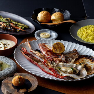 薪の熾火（おきび）で風味豊かに調理した大地と海の贅沢な恵み