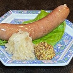 バー エグザゴーヌ - 阿蘇豚のジャンボフランク