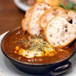 Blueno Oriental Bistro - 2024.11 炙りチーズの牛スジ煮込み（1,210円）