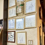 グリル佐久良 - 店内には有名人のサインが飾られている