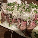 地酒と道産食材 一笑 - 内もも肉のねぎまみれ