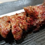 蘭州拉麺店 火焔山 - 串焼きの表情。