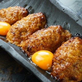 Enjoy juicy Yakitori (grilled chicken skewers) and meatballs with beer or sake.