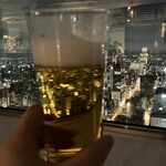 T'CAFE - ビールに映る夜景
