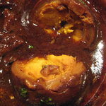 Nami - 洋風もつ煮込み　卵割ってみた