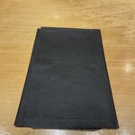 銀座 朧月 - 紙エプロン(セルフ)券売機前