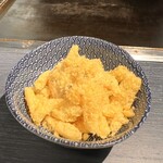 もんじゃ 北がわ - 細かく砕いたうまい棒をかけていただきます♪