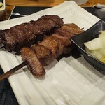 たんか 清川本店 - 手前)牛タン串
                                奥) 牛サガリ串