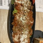 魚豪商 コダマ - 看板メニューのコラ豚トマトガーリックソース