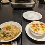 魚料理 炭火串焼 かねり - モツ鍋の食べかけ　グラタン