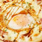 Pizza with soft-boiled egg and pancetta