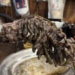 焼鳥丸万 - もも焼き　骨付き　¥1400