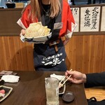 地酒と道産食材 一笑 本店 - 大きな帆立貝の御披露目
