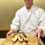 徳ㇵ本也 - 焼き場でこんがり焼かれたきりたんぽ。