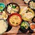 角打ち 小野の離れ - 料理写真:品数豊富でトレイから溢れそう♪ごまトロイワシ＆若鶏唐揚げのWメインに種類豊富な小鉢、サラダに刺身やみそ汁まで！内容充実の定食1,080円