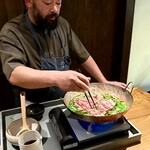 レストラン ウオゼン - ❽月輪熊・猪鍋
      〜月輪熊ロース、猪肉と山菜9種（ウルイ、芹、浅葱、行者大赤、三葉、筍、コゴミ、コシアブラ、山椒）。目の前でご主人がダイナミックに鍋奉行