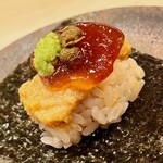 おかめ寿司 - 鮟肝の有馬煮。煮凝りと山椒の実、本山葵をトッピングし、有明一番の海苔で手巻きにしました