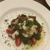 クッチーナイタリアーナ阪井 - タコとジャガイモのサラダ／タコは弾力があり噛むと甘みと旨みがジュワーと溢れマッシュしたじゃがいもが下にどっさり隠れていてバジルが効いてました