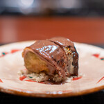 Narayamachi Ao - Charcoal-grilled Kumamoto Red Eggplant Wrapped in Hokkaido Sanma, Served with Shaved Chestnuts and a Sauce Made from Sanma Liver