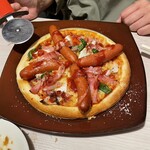 月のささやき - 新玉ねぎのシャキッとさがキラリと光るピザ