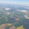 Austrian Airlines Business Lounge Non-Schengen - ライプツィヒ・ハレからウイーンに向かう飛行機から　黄色いのは菜の花畑です