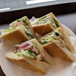 Amazon - Sandwich filled with plenty of lettuce, cucumber, and ham.