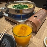 博多牛もつ鍋 なの川 - まる搾りみかんジュース