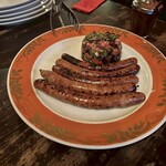 ピニョン - ⚪︎自家製のメルゲーズ　アリッサ
      (羊のソーセージ)