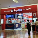 たこ寿 - 外観(奥の赤い所がスガキヤさん、手前の青い所がたこ寿さん。セルフオーダー機は両店舗共通です。)