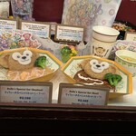 ミゲルズ・エルドラド・キャンティーナ - メニュー。スペシャルドリンク以外なら、ダッフィの紙コップ？みたい。セットセットメニューには、ランチマット付きますよ