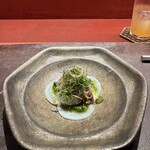 304946652 - 1皿目
                        中国茶で煮たタコの山椒ソース