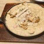 カプリチョーザ トマト＆ガーリック - もち豚とポルチーニのリゾット