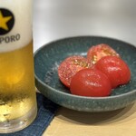 お好み焼き しみづ - ボードメニューから「トマトお浸し」490円
      お出汁がしみたトマトもええなぁ